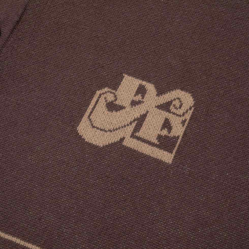 Chocolate Tilde Stamp Knit Polo with jacquard texture and logo detail.