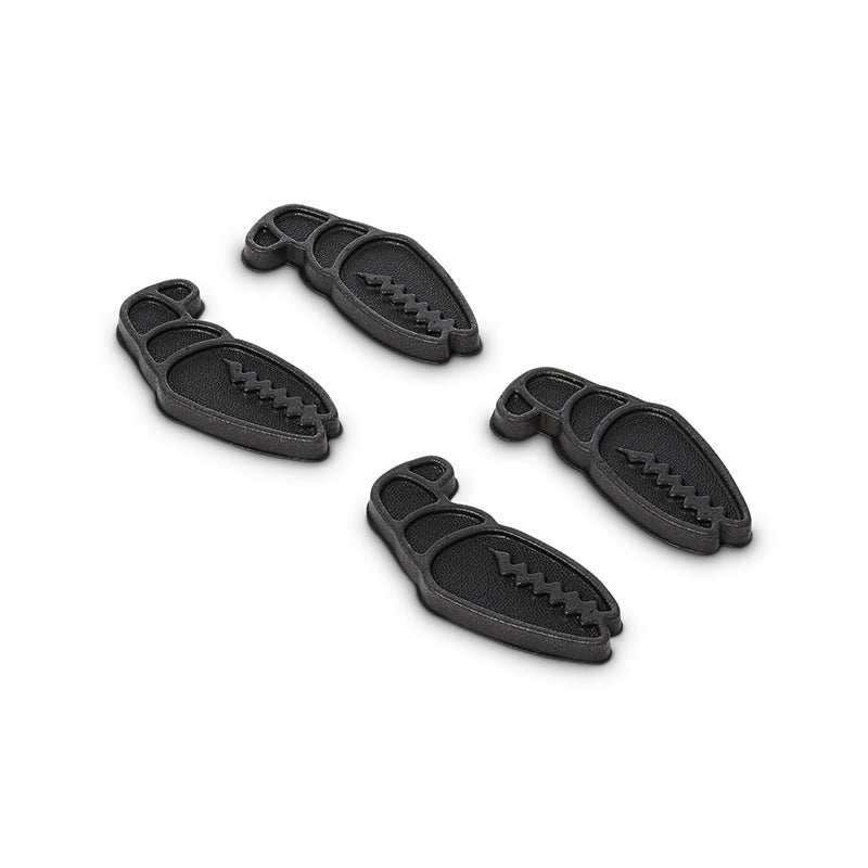 Set of four black MINI CLAWS textured grip pads for customization and enhanced grip.
