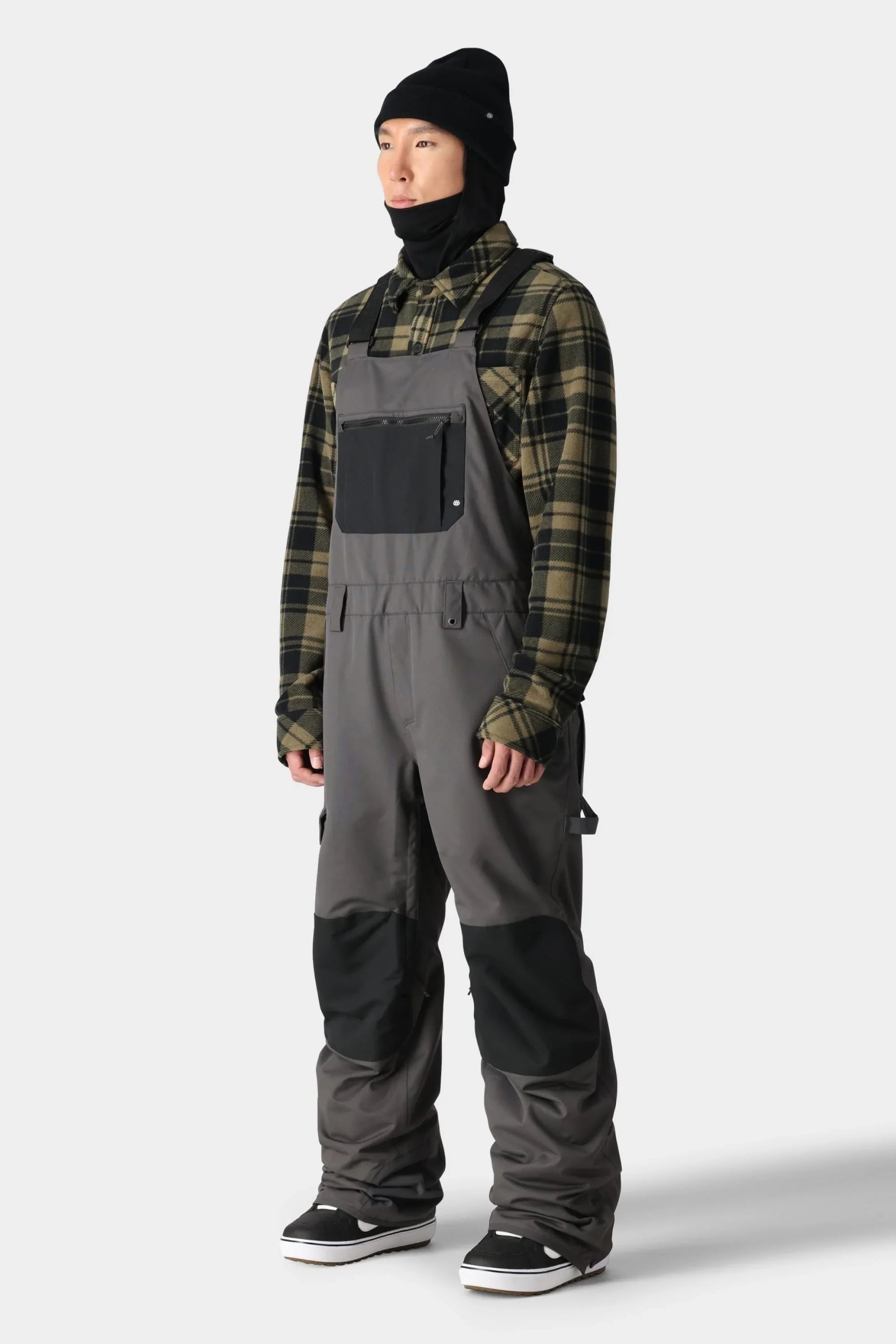 Insulated bibs with pockets, adjustable straps, and reinforced panels for cold climates.
