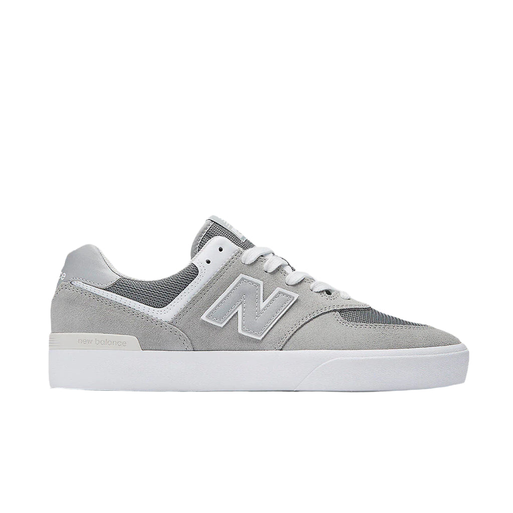 New Balances NM574VGY -tossut ikonisessa mallistossa, vulkanoitu rakenne ja vahvistettu kärki.