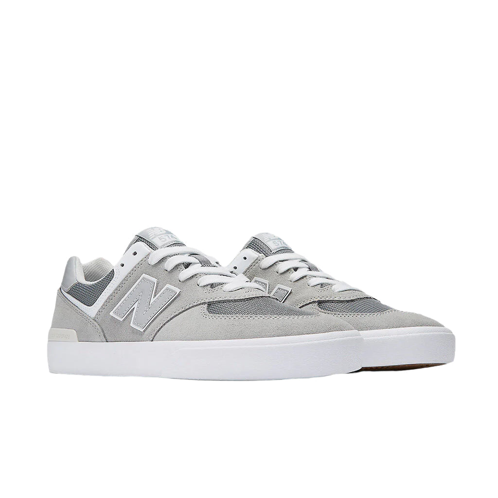 New Balance NM574VGY -tennari, vulkanoitu rakenne, ikoninen malli, New Balancen historia.