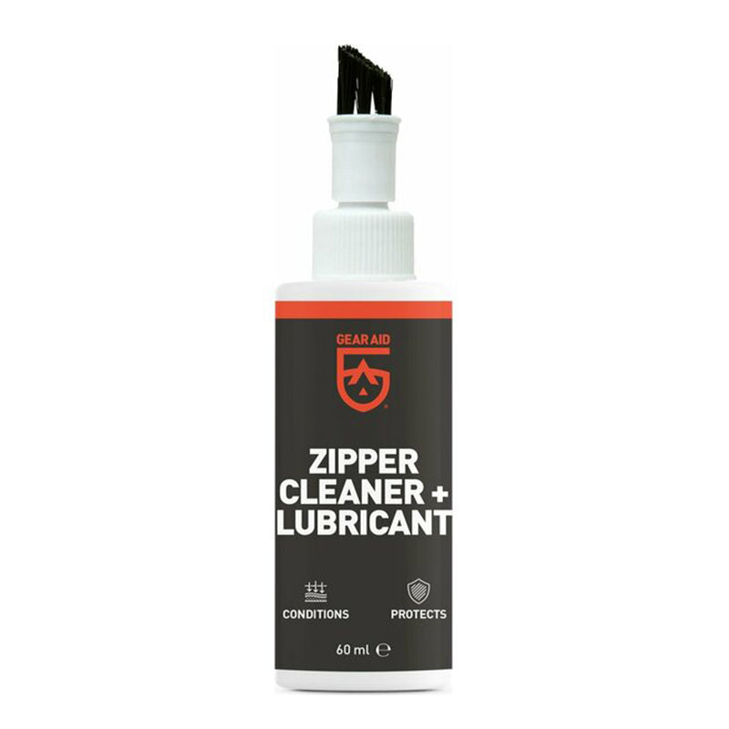 Zipper cleaner and lubricant bottle with brush-top for maintaining zippers.