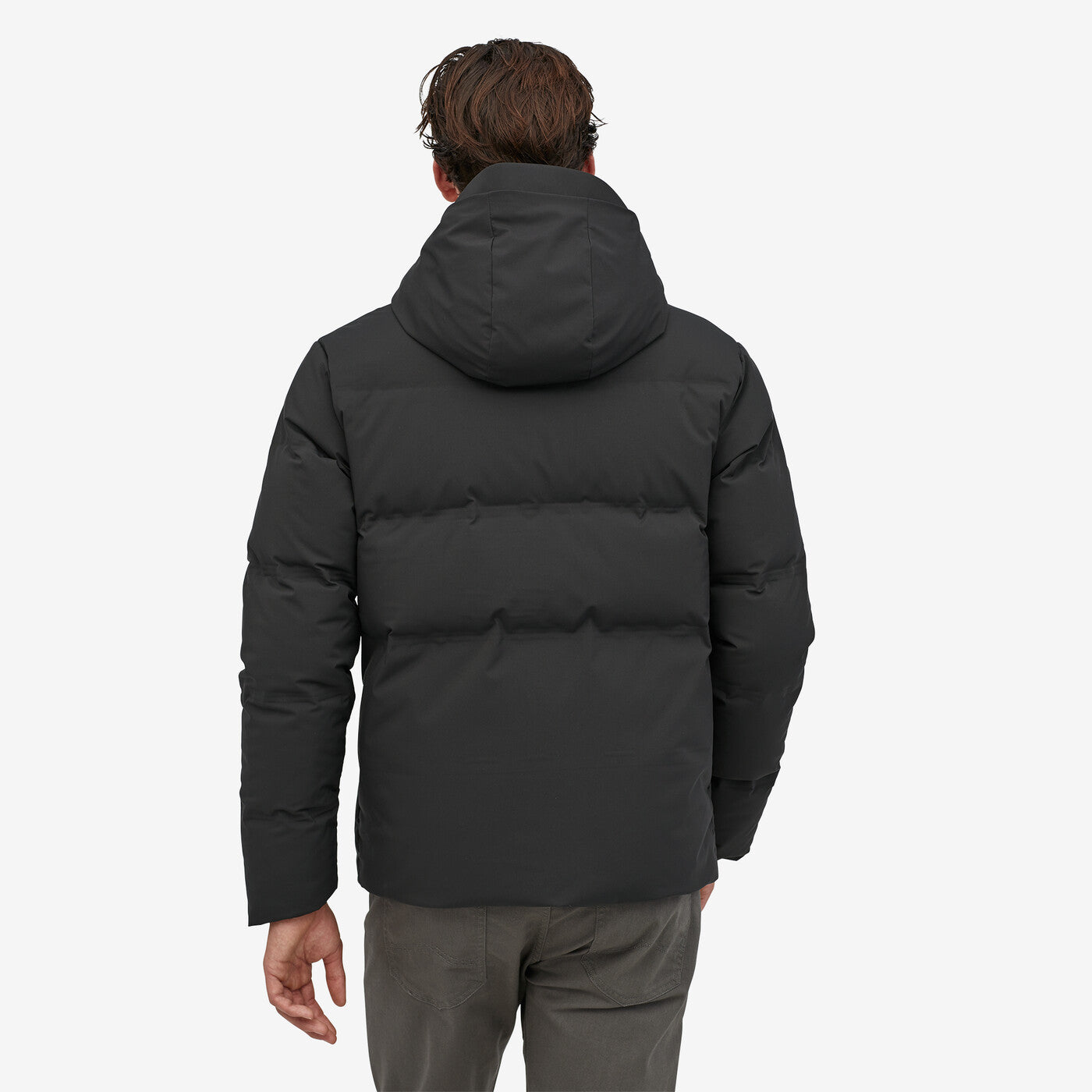 Patagonia Jackson Glacier Jkt in black with insulated hood and weather-proof shell.