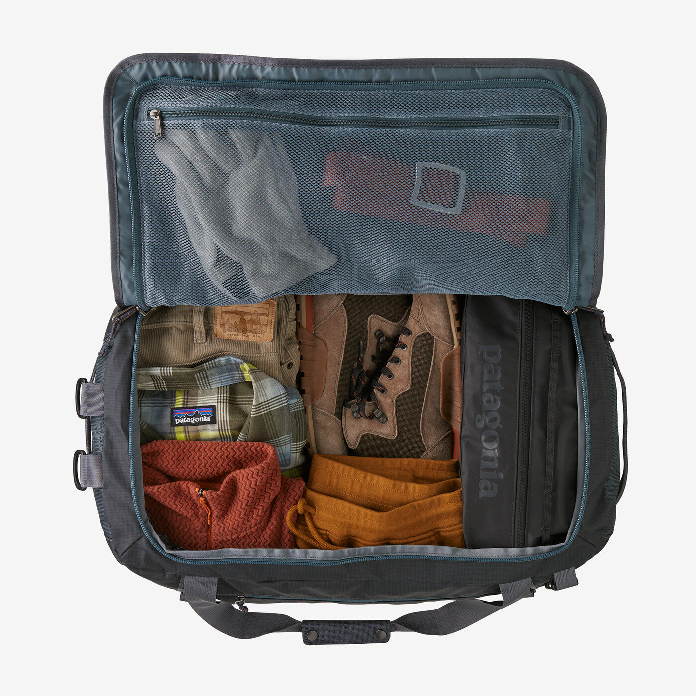 Open Patagonia Black Hole Duffel 55L showing organized internal compartments.