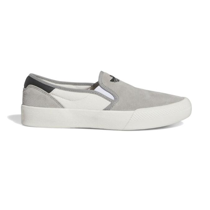 Low top Shmoofoil Slip skate shoes from Adidas in slip-on design with suede and canvas upper.