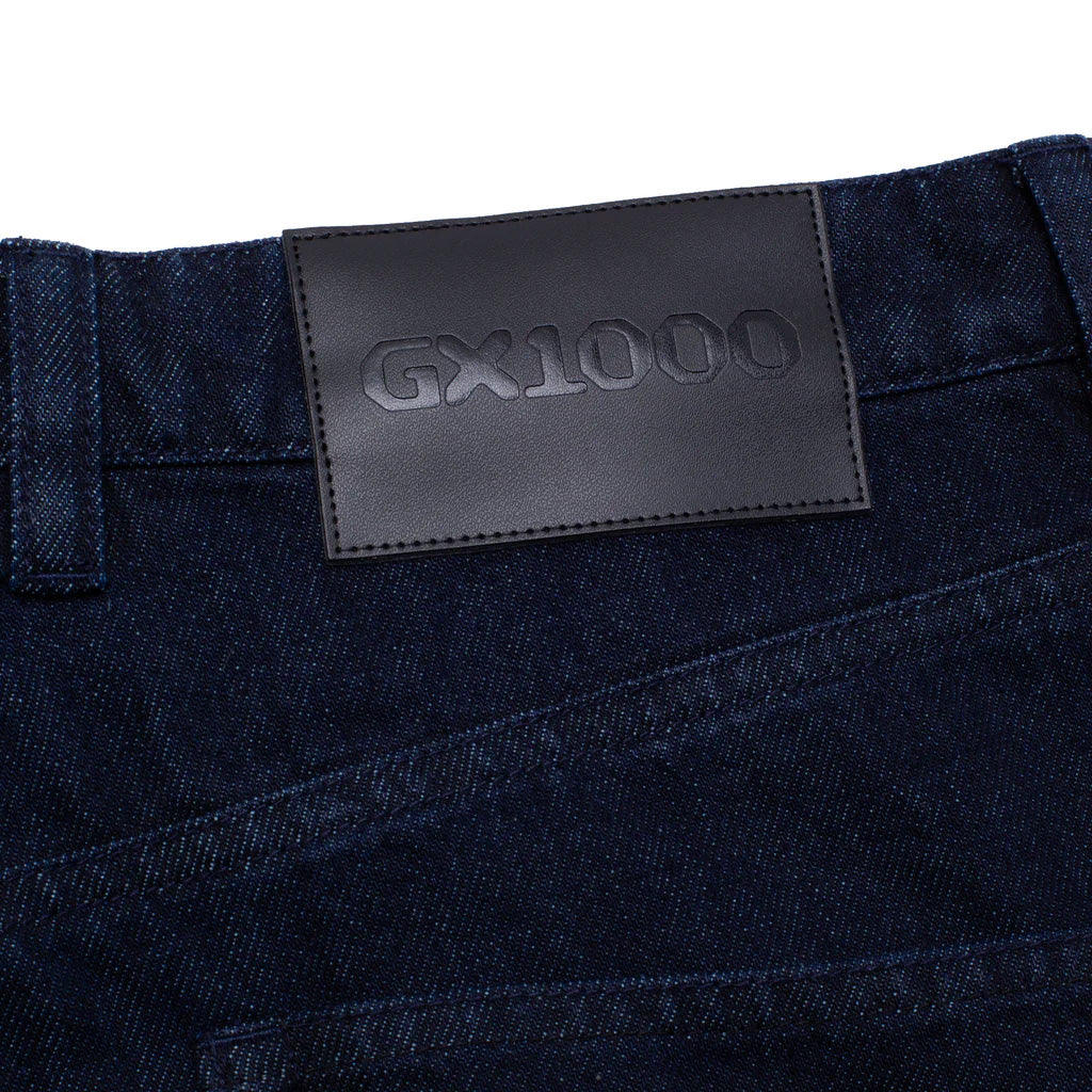 GX1000 baggy pant with faux leather label and direct embroidery on rear pocket.