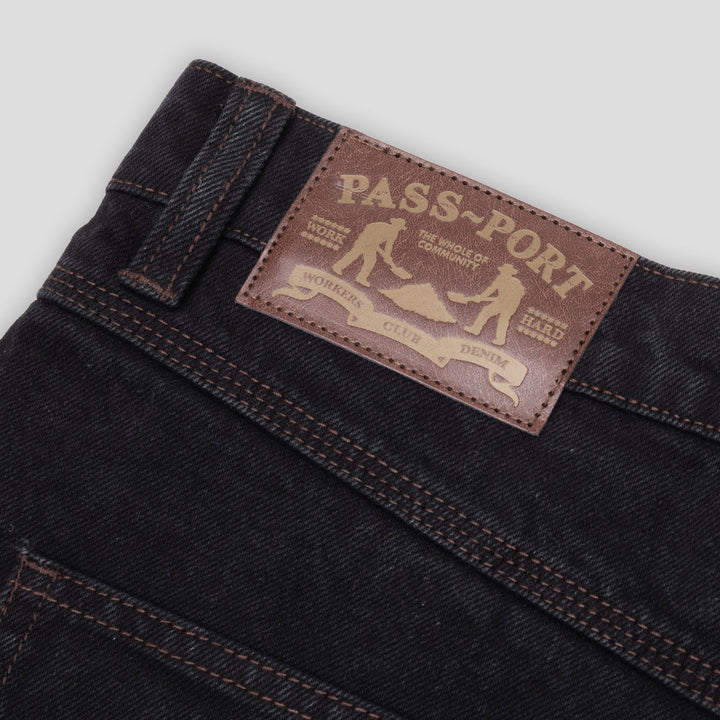 PASS-PORT Workers Club jeans in washed black with brown contrast stitching and faux leather label.