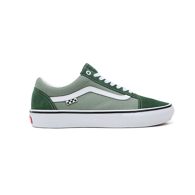 Vans Old Skool sneakers in green suede and canvas, featuring a white rubber sole and classic low-top design.